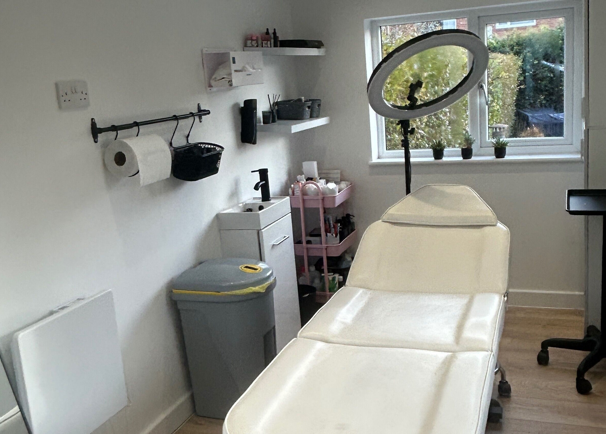 Dayna Louise treatment room in Leeds, England, GB with a spa bed and modern decor.