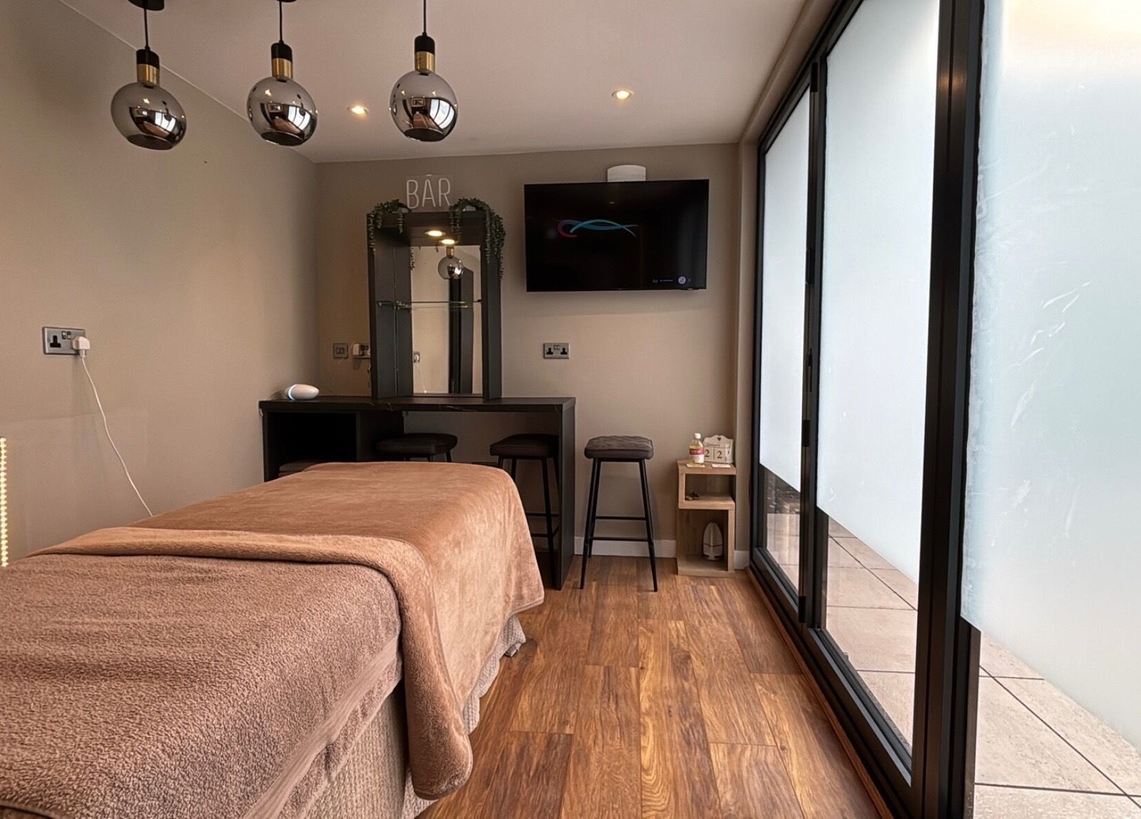 Cozy massage room at Massage Therapy by Nicola in Chorley, England, GB, featuring a plush treatment table.