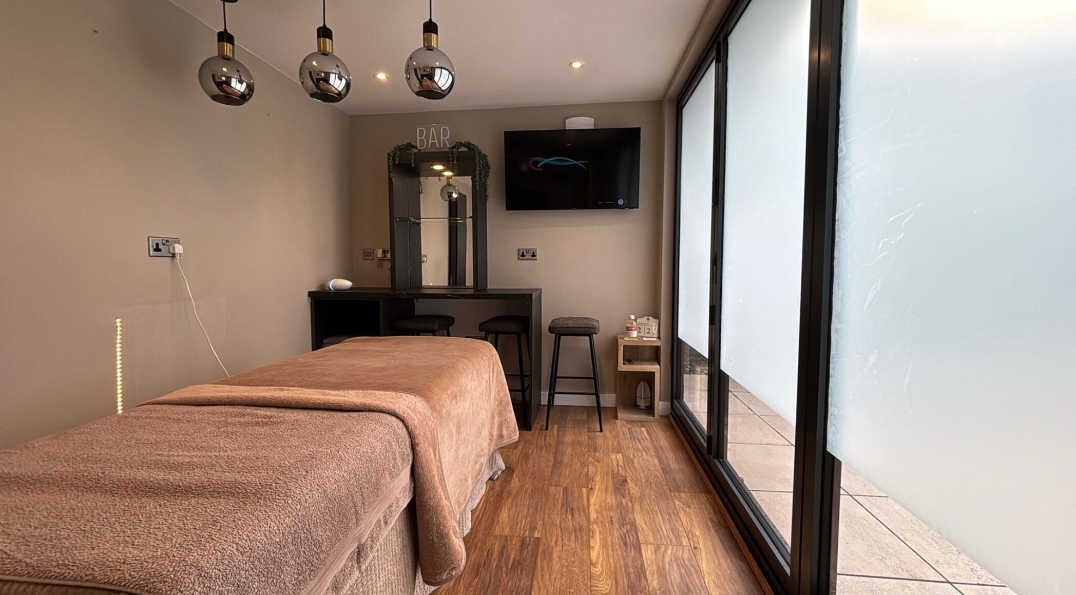 Cozy massage room at Massage Therapy by Nicola in Chorley, England, GB, featuring a plush treatment table.