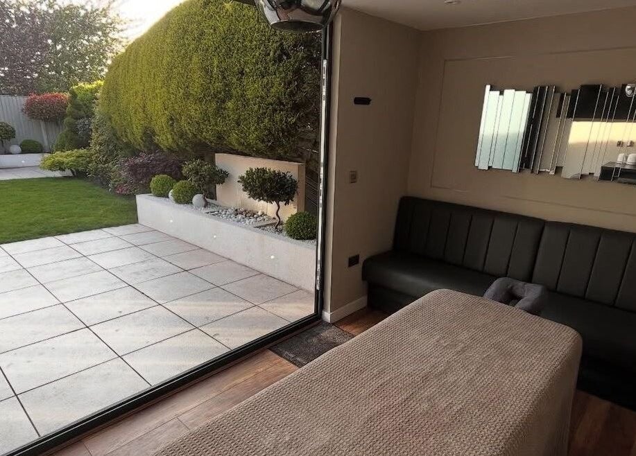 Relaxing massage room at Massage Therapy by Nicola in Chorley, England, GB with garden view.