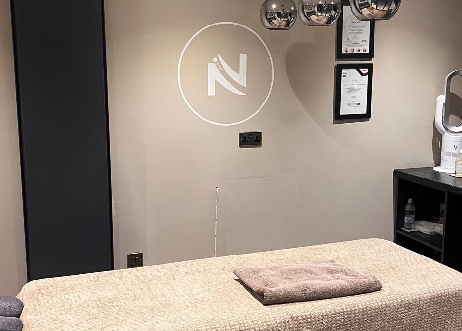 Relaxation room at Massage Therapy by Nicola, Chorley, England, GB. Features a massage table and modern decor.