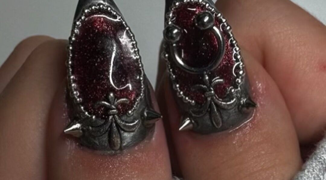 Unique gothic nail art with metal details at Byhollie in Rochdale, England, GB.