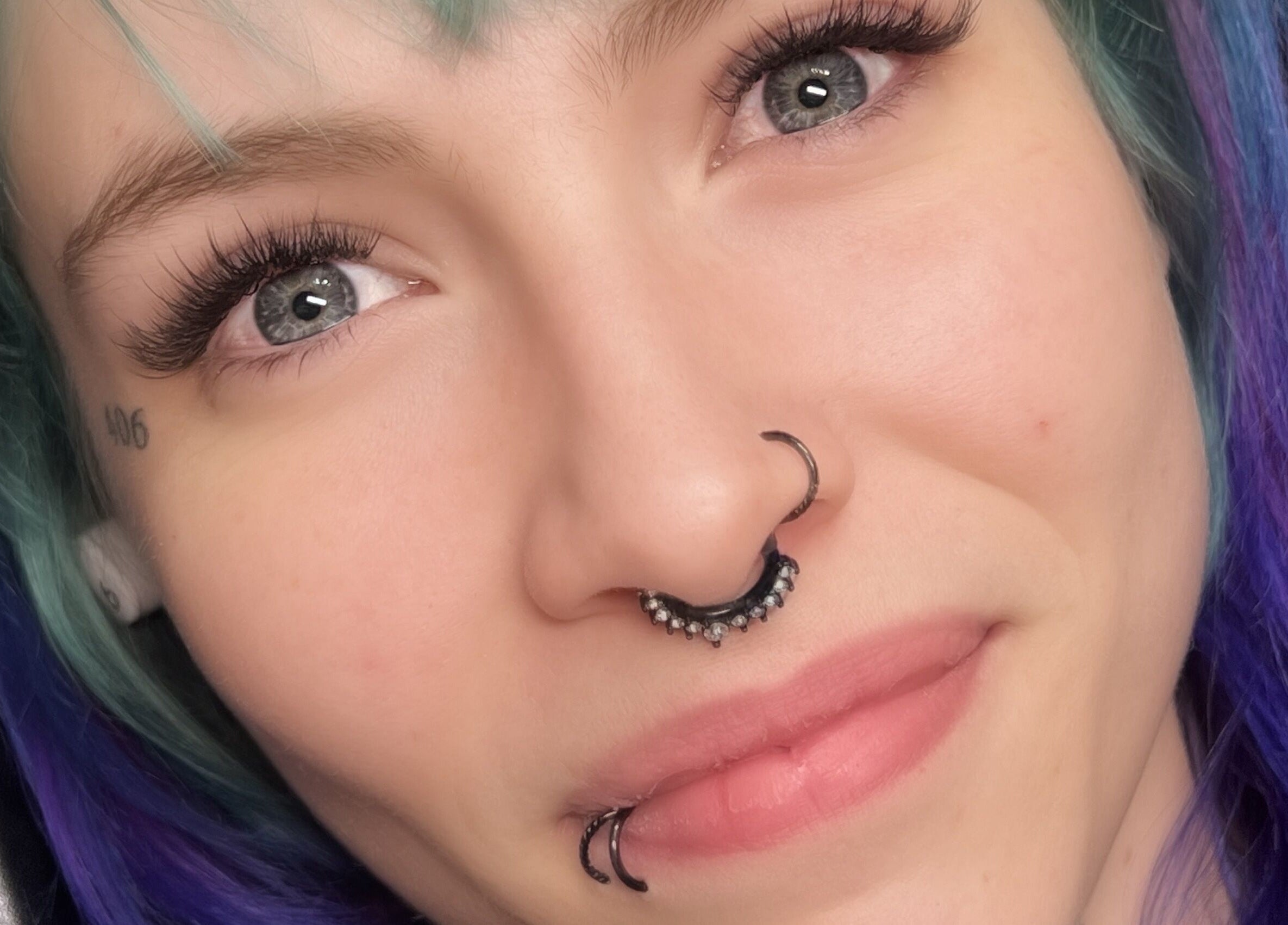 Close-up of lush lashes styled at Mimi Does Lashes, Dartmouth, Nova Scotia, CA. Vibrant hair and piercings.