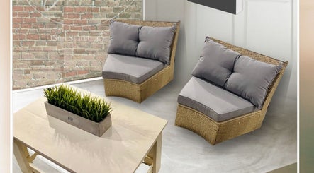 Relaxing seating area at Sun Studio Tan, Columbus, Ohio, US with wicker chairs and modern decor.