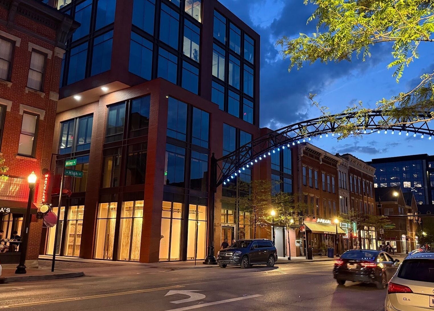 Evening street view near Sun Studio Tan, Columbus, Ohio. Urban architecture and vibrant nightlife lighting.