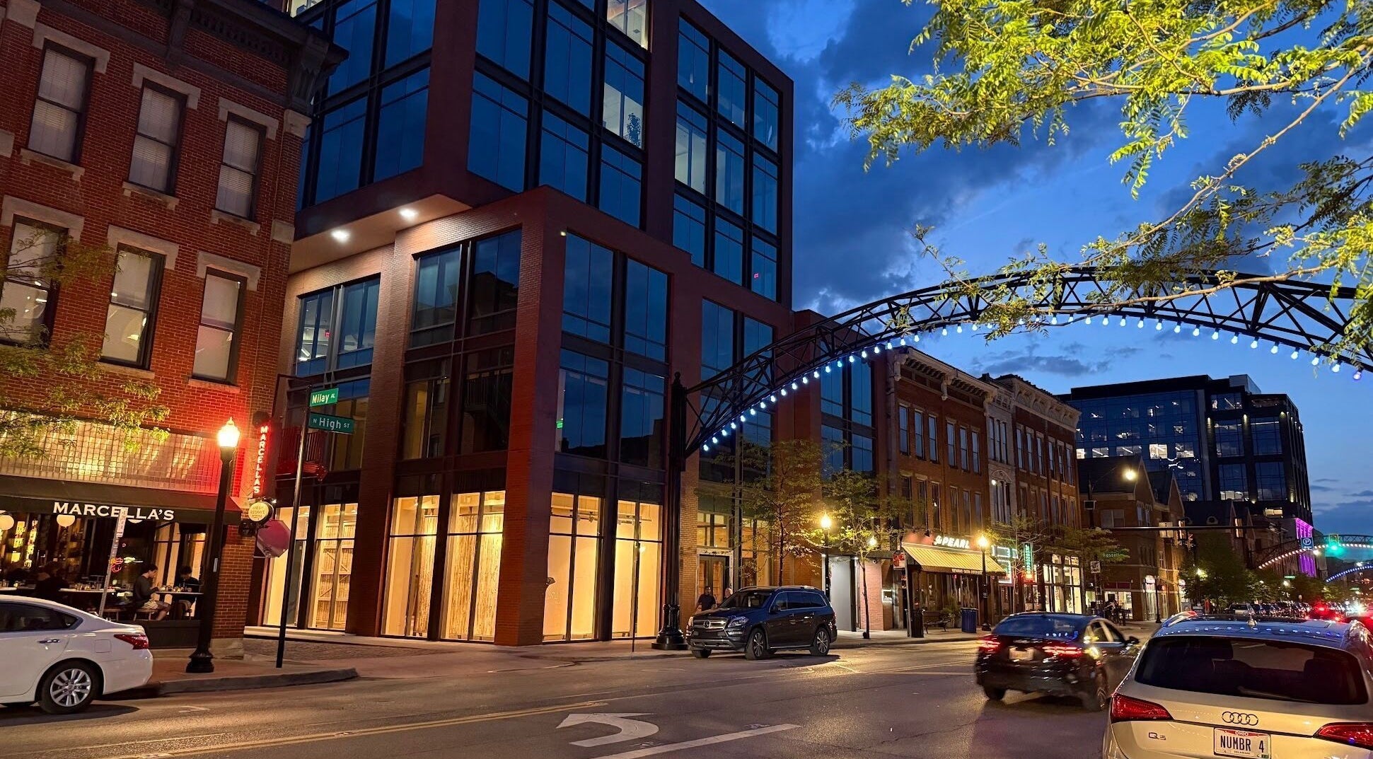 Evening street view near Sun Studio Tan, Columbus, Ohio. Urban architecture and vibrant nightlife lighting.