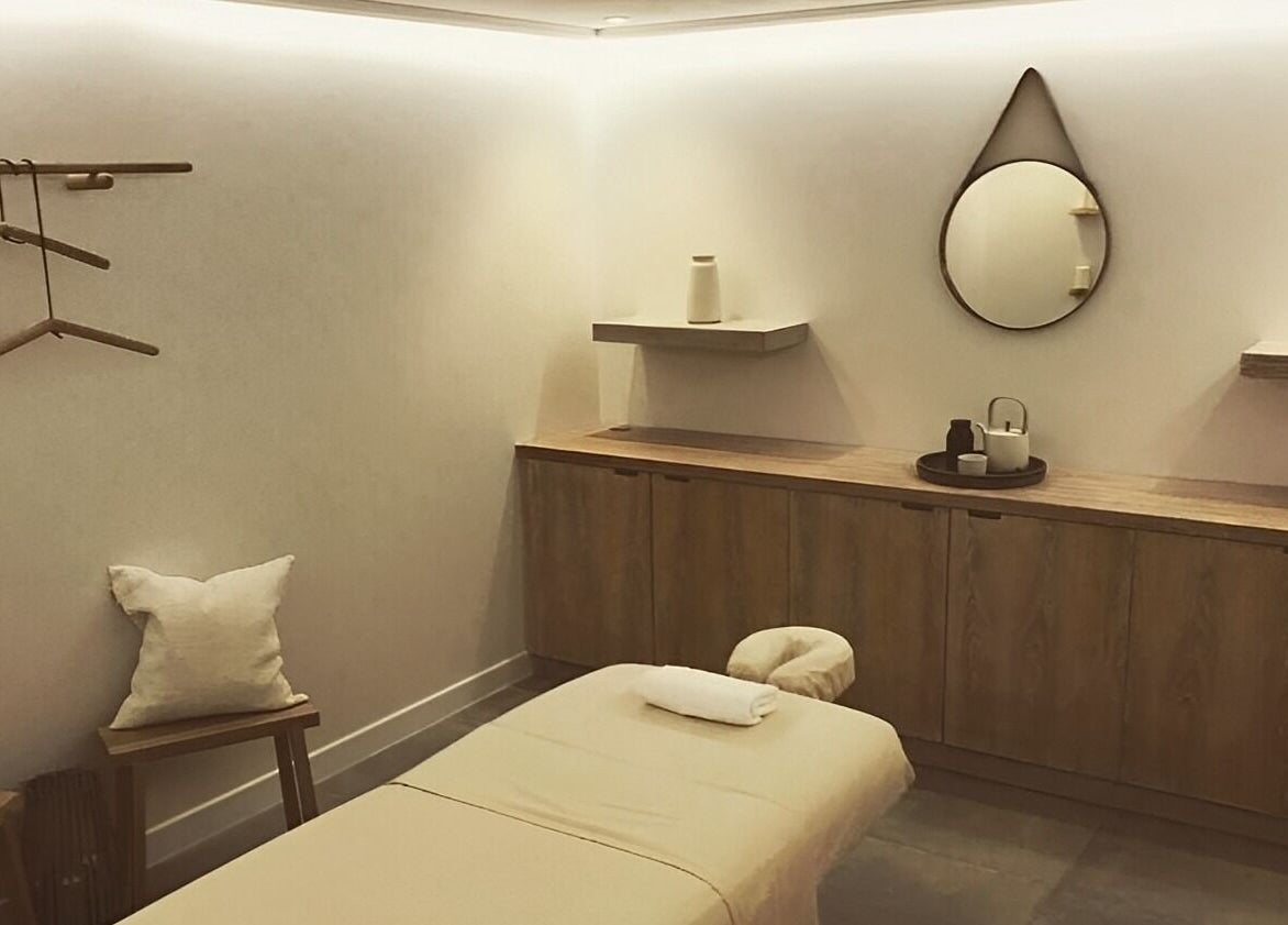Elegant spa room at The Method, Edinburgh, Scotland, GB, featuring a massage table and soothing decor.