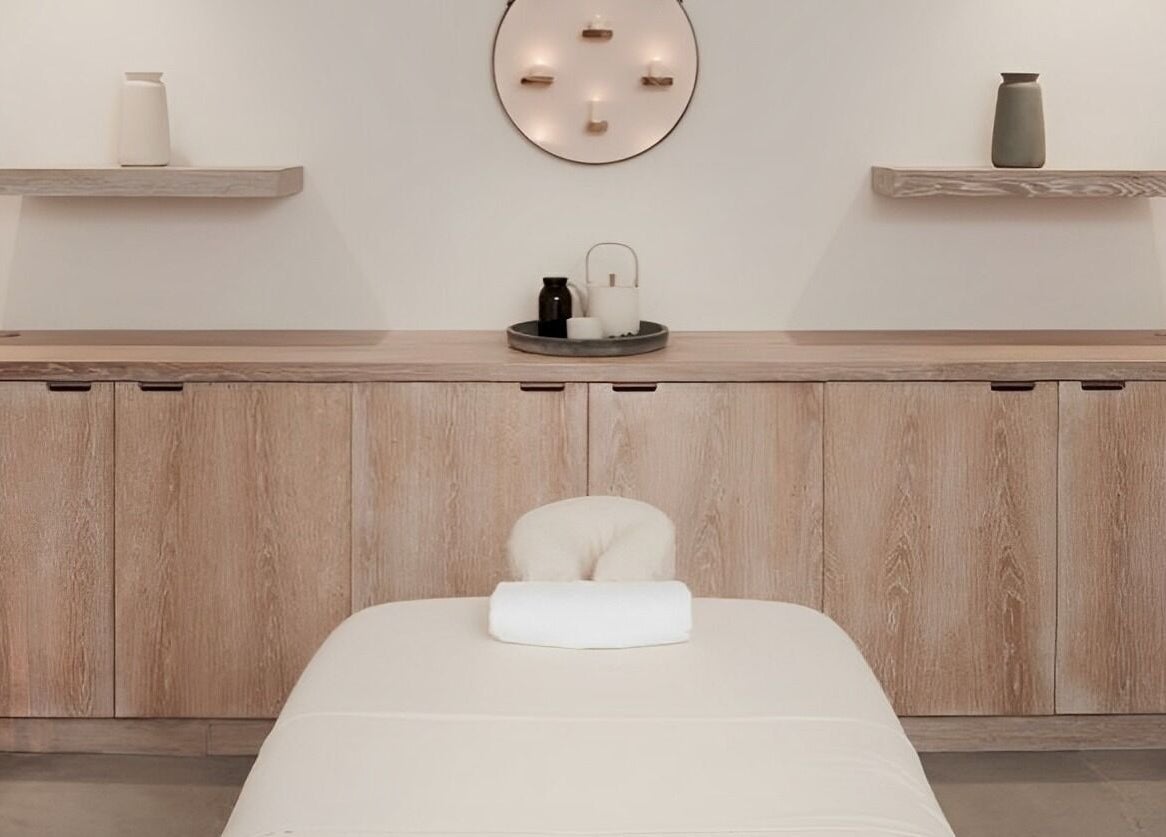 Relaxing spa room at The Method in Edinburgh, Scotland, GB, featuring a massage table and calming decor.