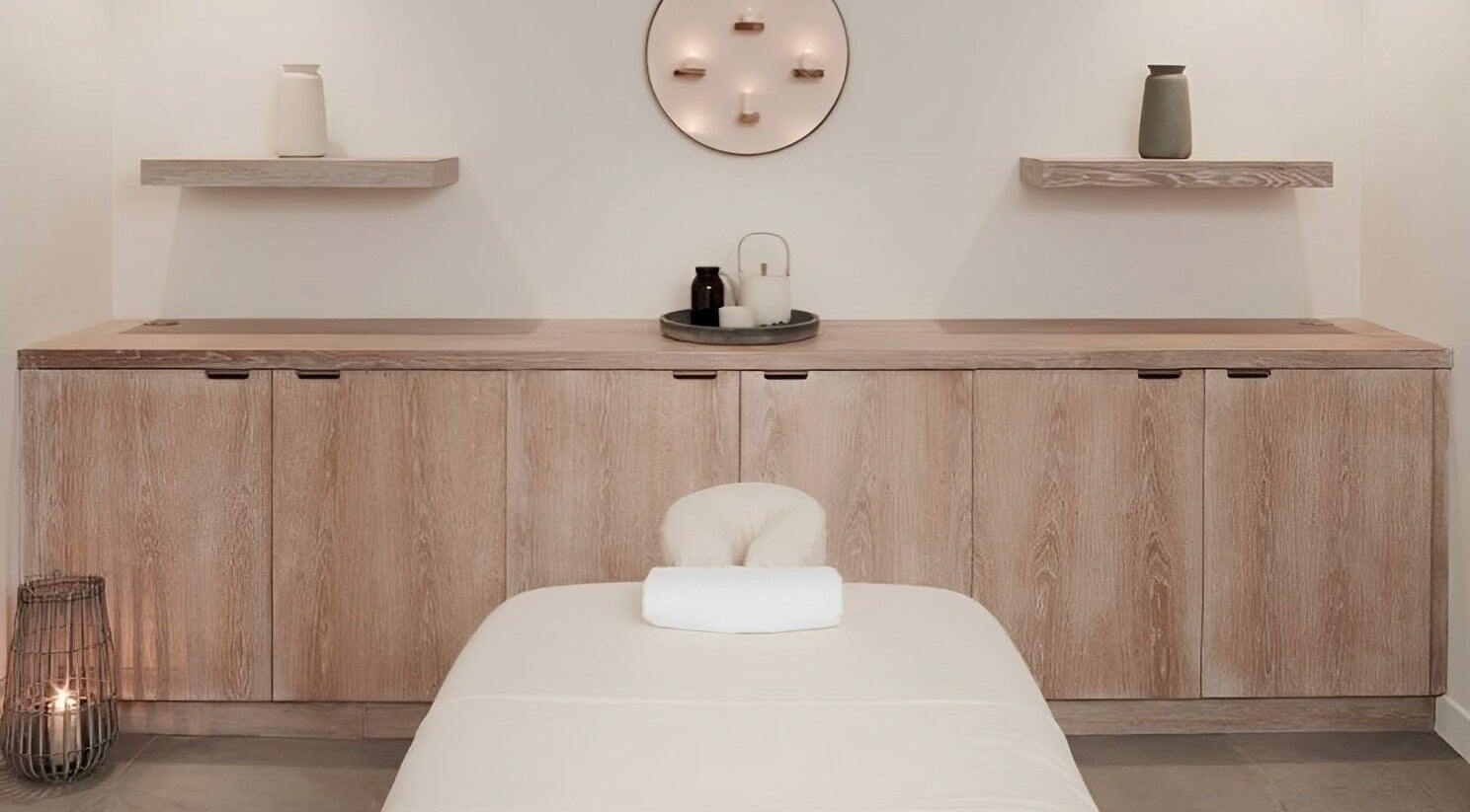 Relaxing spa room at The Method in Edinburgh, Scotland, GB, featuring a massage table and calming decor.