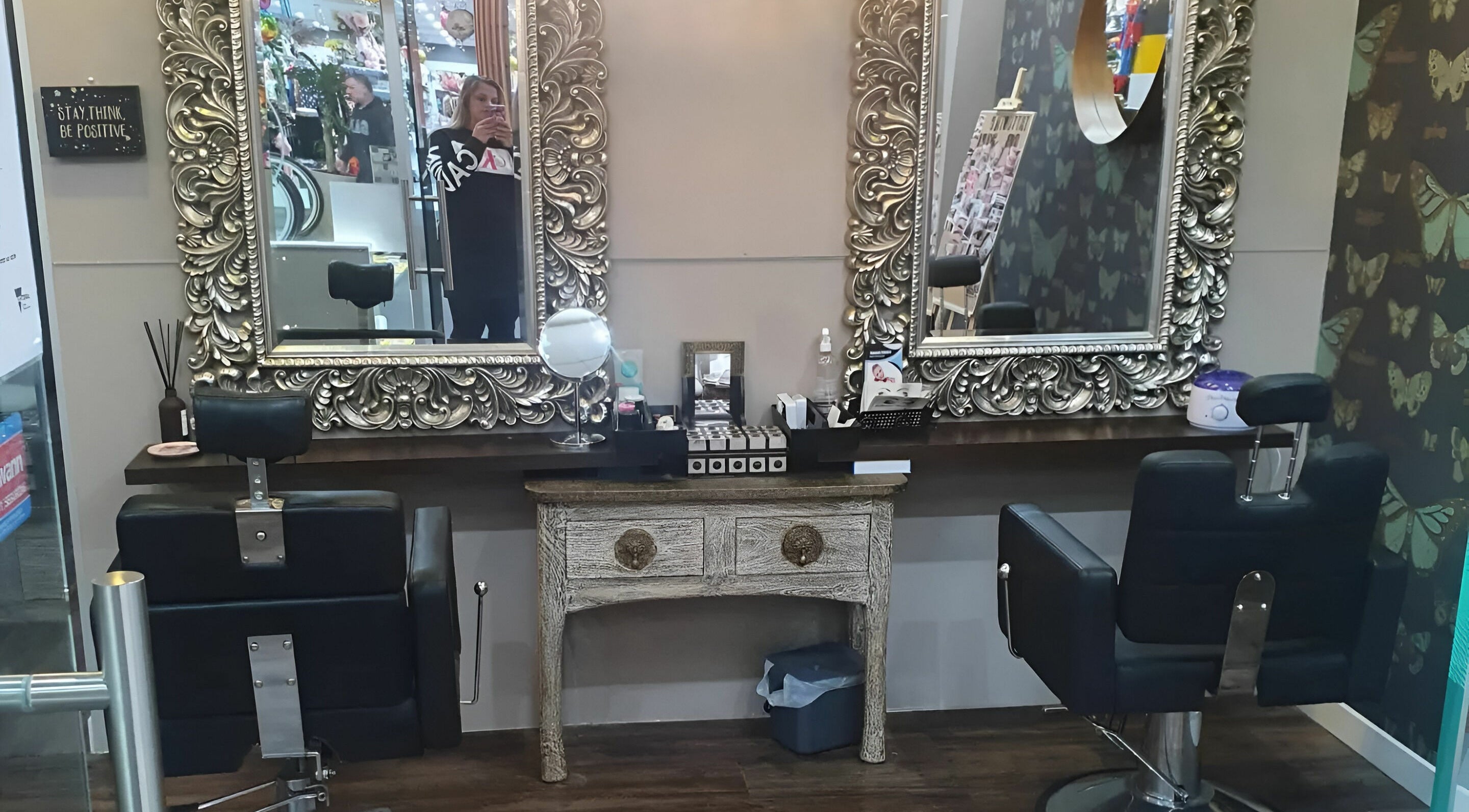 Stylish hair salon setup at INKredible Beauty N Laser, Melbourne, Victoria, AU featuring ornate mirrors.