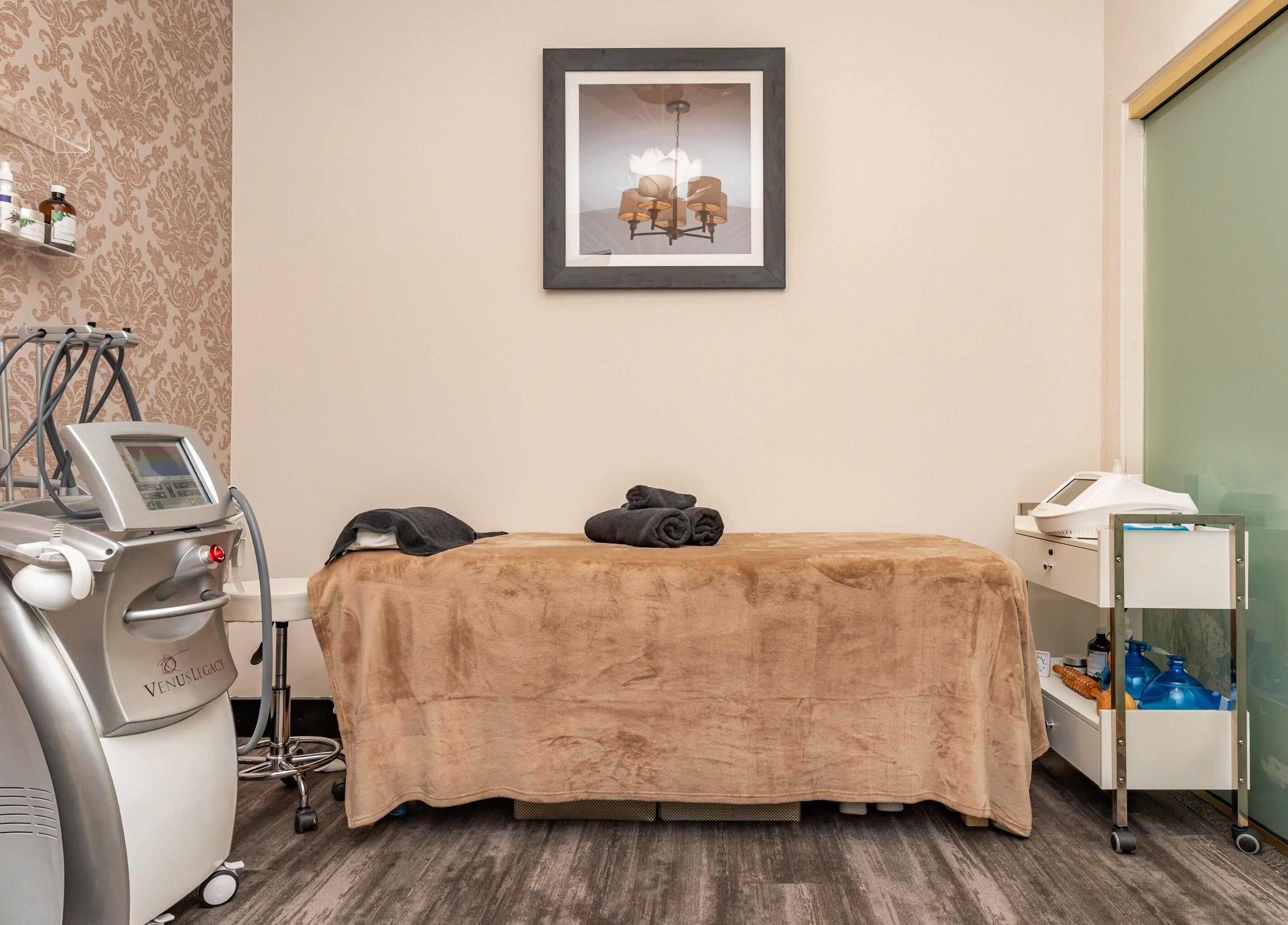 Cozy treatment room at NU Laser Spa, Great Neck Plaza, New York, US with modern equipment.