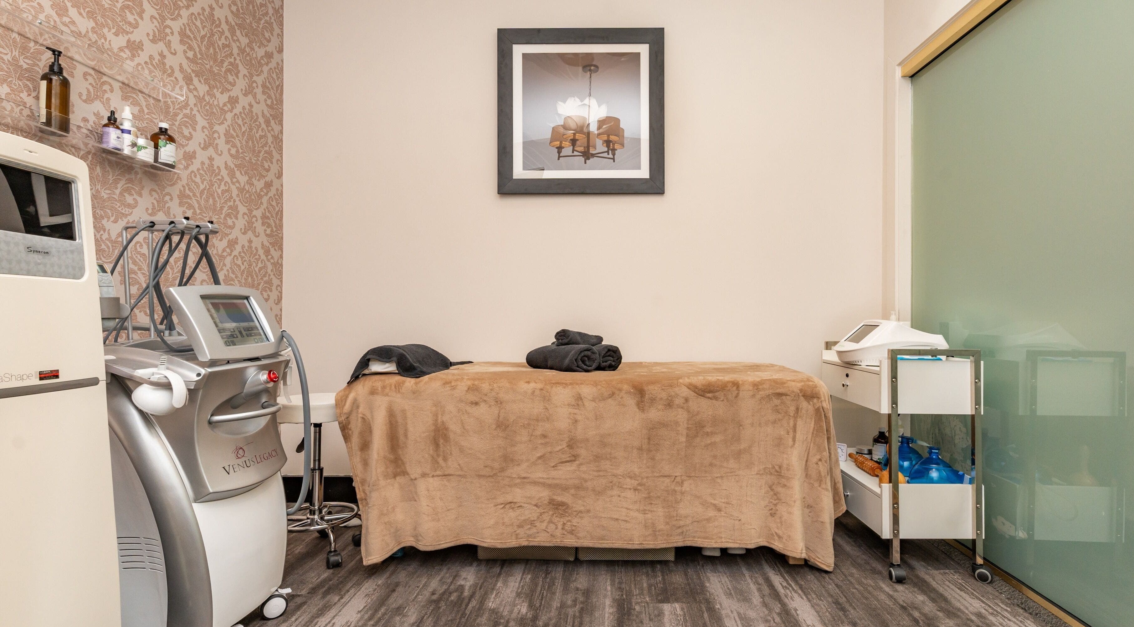 Cozy treatment room at NU Laser Spa, Great Neck Plaza, New York, US with modern equipment.