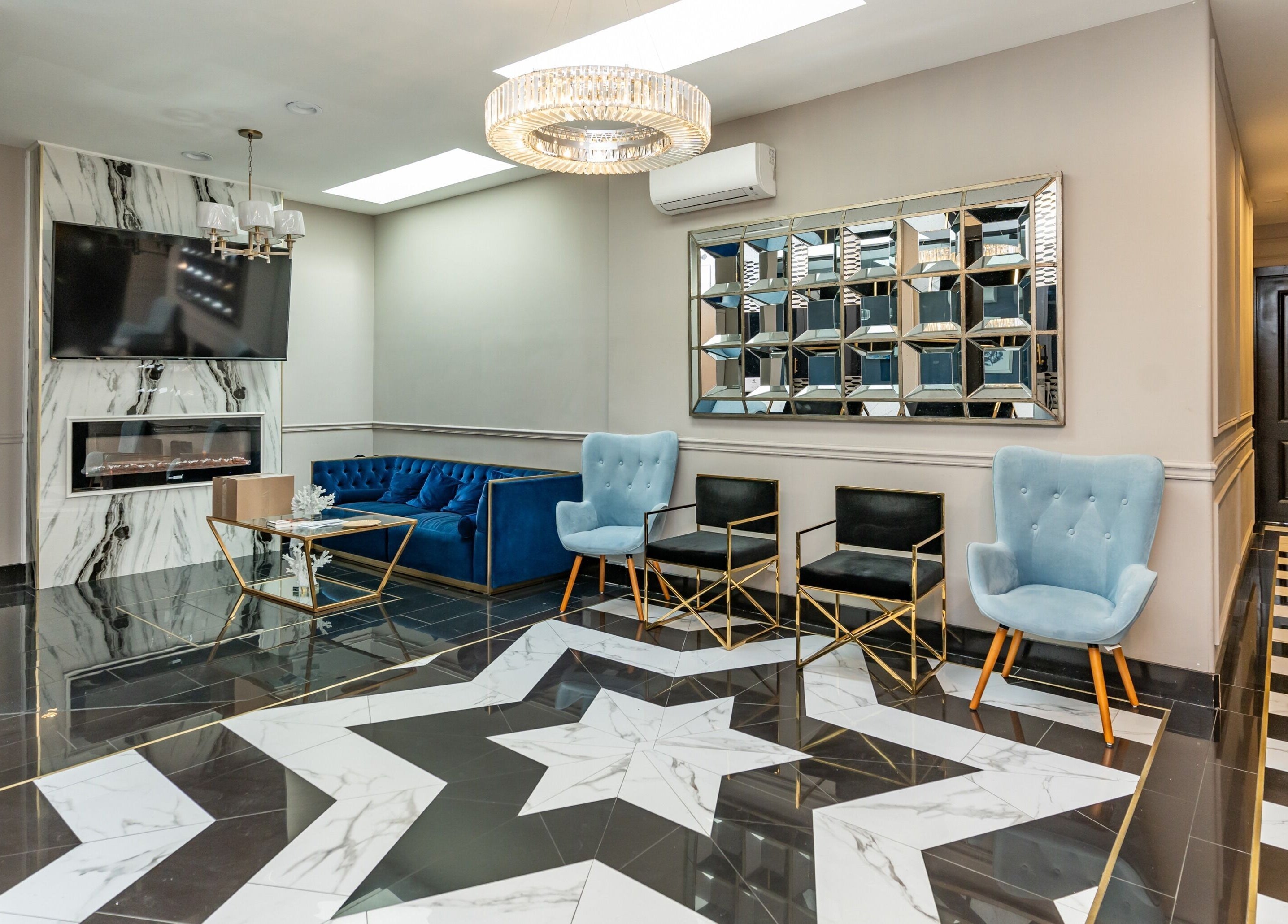 Elegant lobby at NU Laser Spa, Great Neck Plaza, New York, US with stylish seating and modern decor.