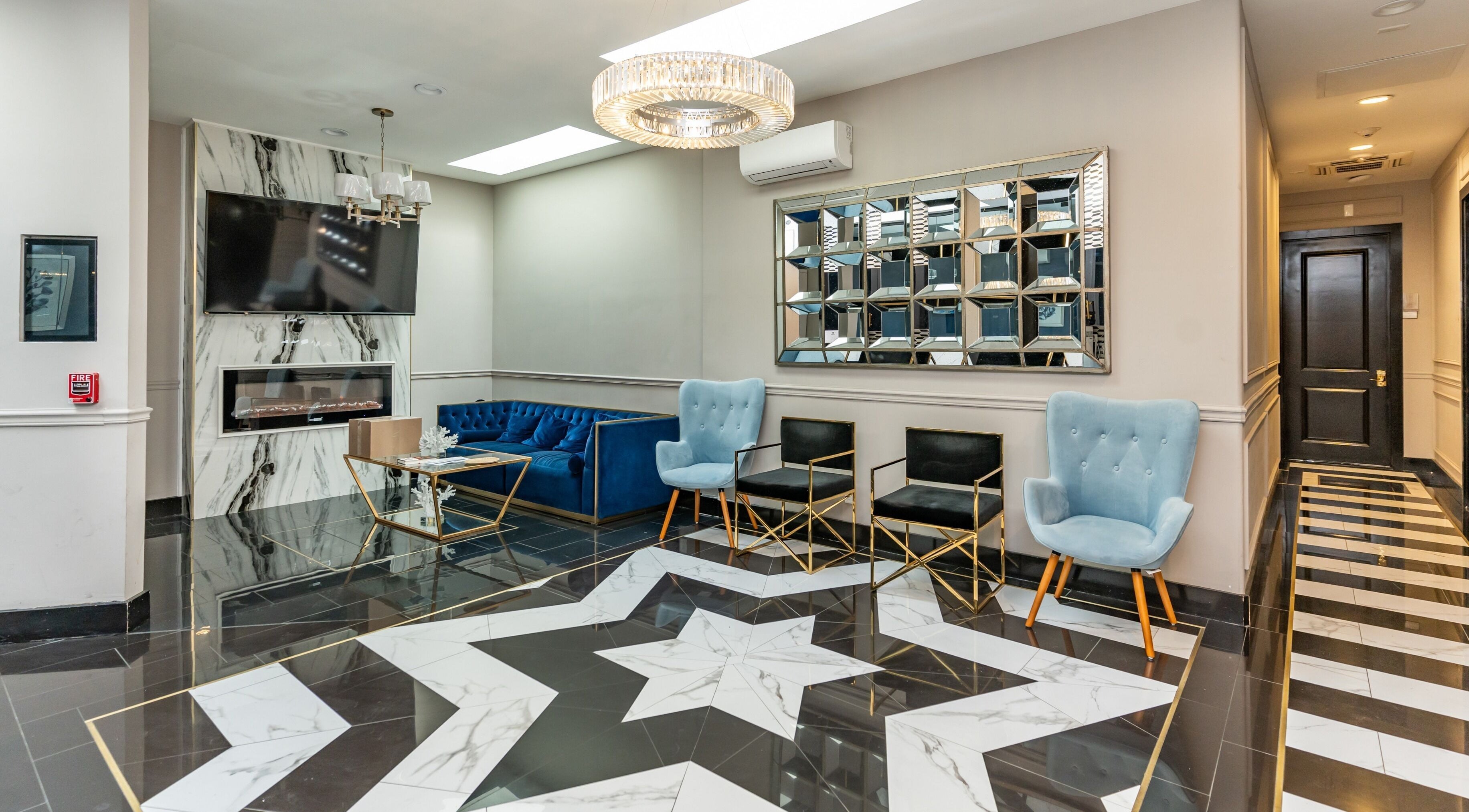 Elegant lobby at NU Laser Spa, Great Neck Plaza, New York, US with stylish seating and modern decor.