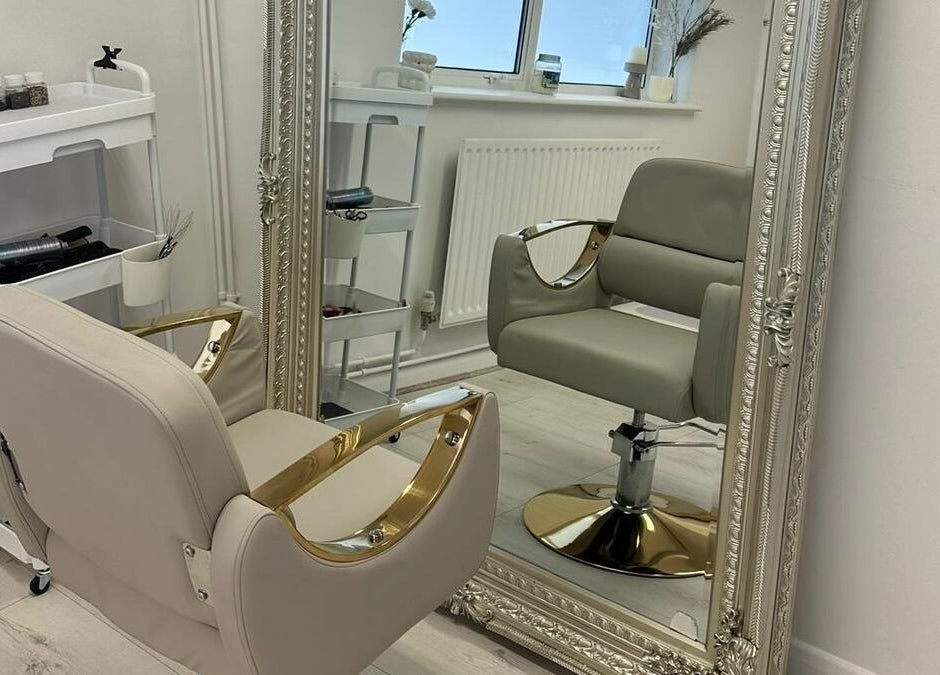 Elegant salon chair and ornate mirror at JM Aesthetically Yours, Hilton, England, GB.