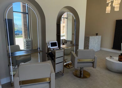 Luxurious salon space at Head Bath Glasgow with modern chairs and mirrors in Glasgow, Scotland, GB.