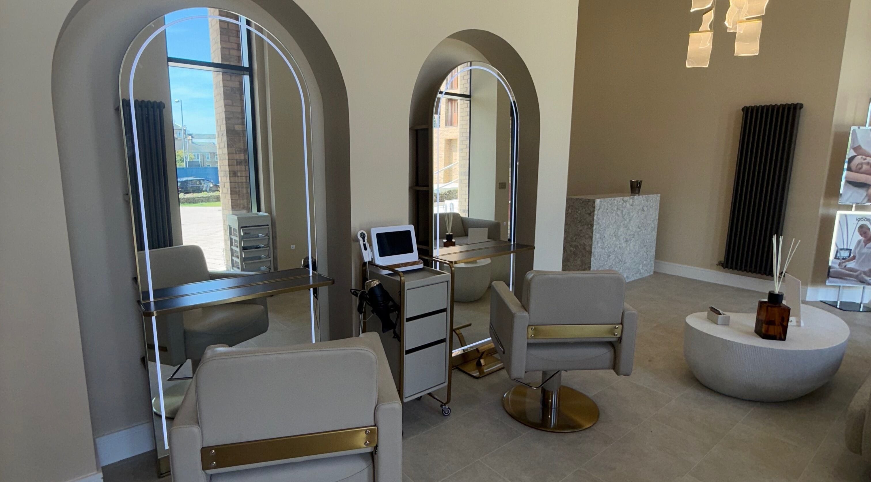 Luxurious salon space at Head Bath Glasgow with modern chairs and mirrors in Glasgow, Scotland, GB.