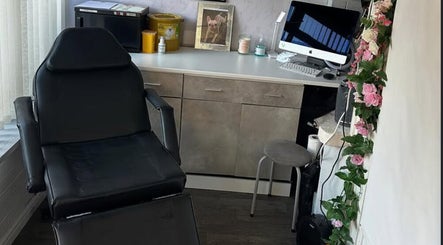 Sophisticated treatment room at Divine Hair and Aesthetics, Middlesbrough, England, GB featuring plush chair and decor.