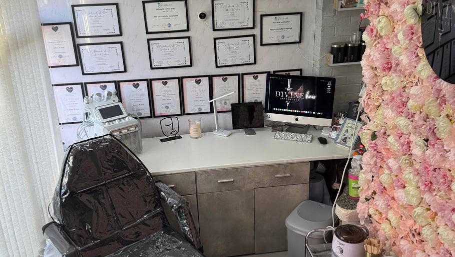 Interior of Divine Hair and Aesthetics in Middlesbrough, England, GB, showcasing flower decor and a treatment chair.