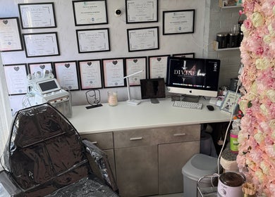 Interior of Divine Hair and Aesthetics in Middlesbrough, England, GB, showcasing flower decor and a treatment chair.