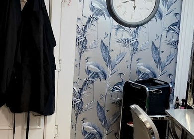 Interior of Divine Hair and Aesthetics, Middlesbrough; chic salon design with floral wallpaper and modern decor.