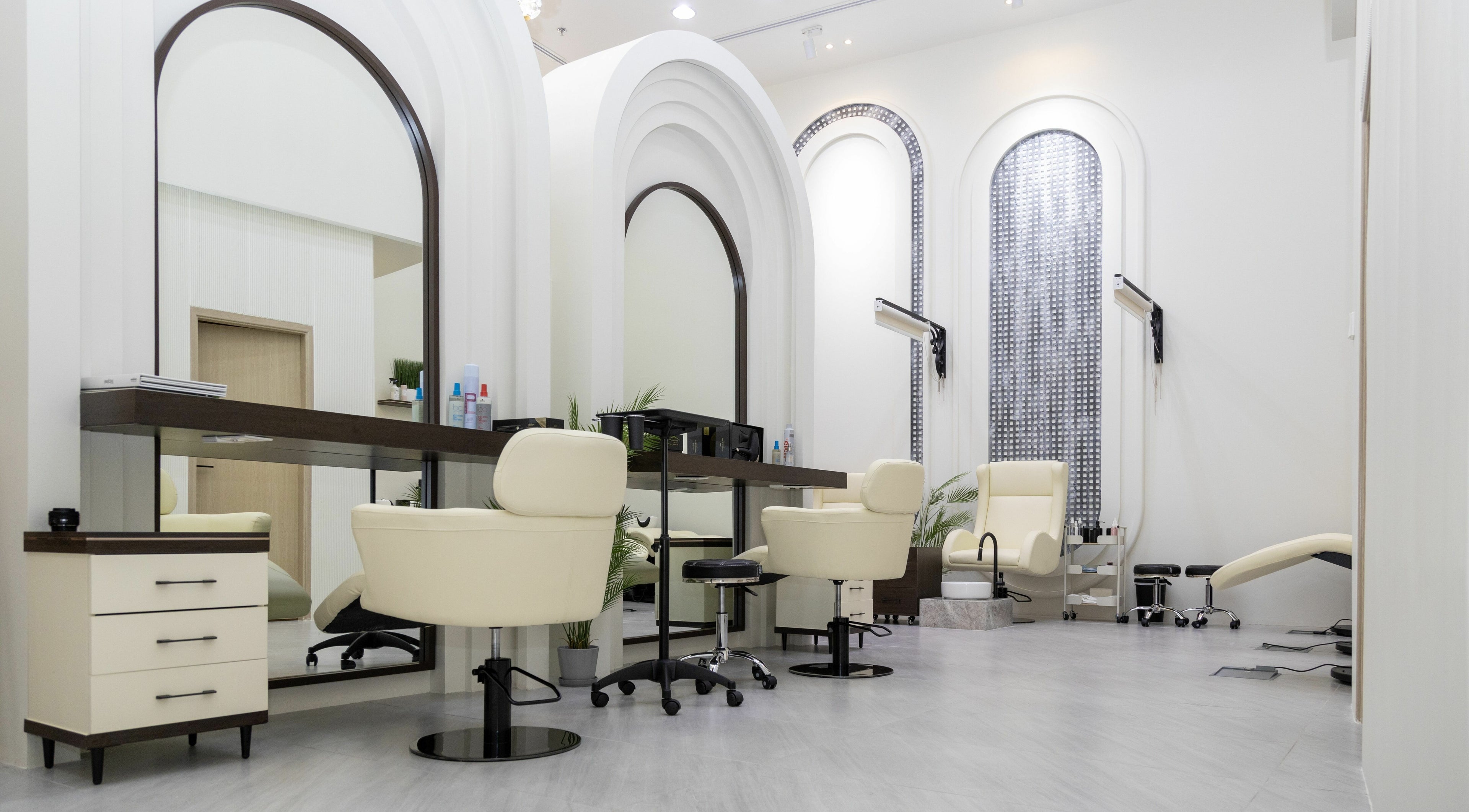 Elegant interior of Eleven Signature Beauty Salon LLC in Dubai, AE, featuring modern styling chairs and decor.