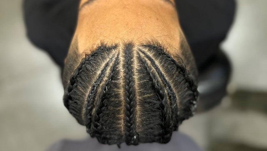 Intricate cornrows hairstyle at Syahrul Ilham, Riau Islands, Riau Islands, ID, showcasing expert braiding.