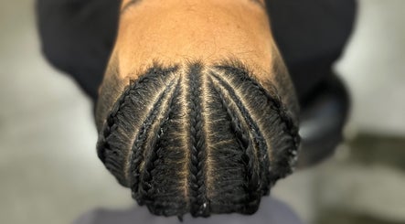 Intricate cornrows hairstyle at Syahrul Ilham, Riau Islands, Riau Islands, ID, showcasing expert braiding.