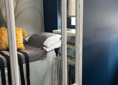 Comfortable bed with yellow pillow at The Firm Durban North, Durban North, Kwazulu-natal, ZA.