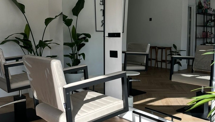 Modern chairs and plants at Luke East Hair salon, Birmingham, England, GB.