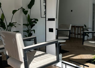 Modern chairs and plants at Luke East Hair salon, Birmingham, England, GB.