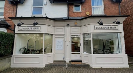 Front view of Luke East Hair salon in Birmingham, England, GB with stylish facade and signage.