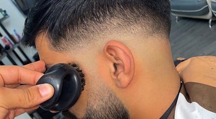Close-up of a haircut with a brush at NJ Clipzz, Keighley, England, GB.