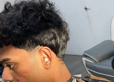 Close-up of a stylishly faded haircut at NJ Clipzz, Keighley, England, GB.