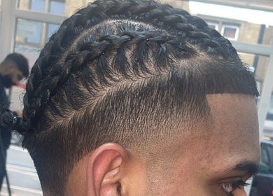 Stylish braided hair at NJ Clipzz, Keighley, England, GB, showcasing expert grooming.