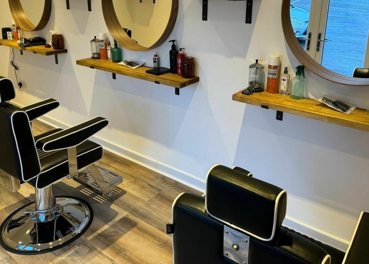 Stylish barber chairs and mirrors at Headspace Barbers in Walsall, England, GB, showcasing modern design.