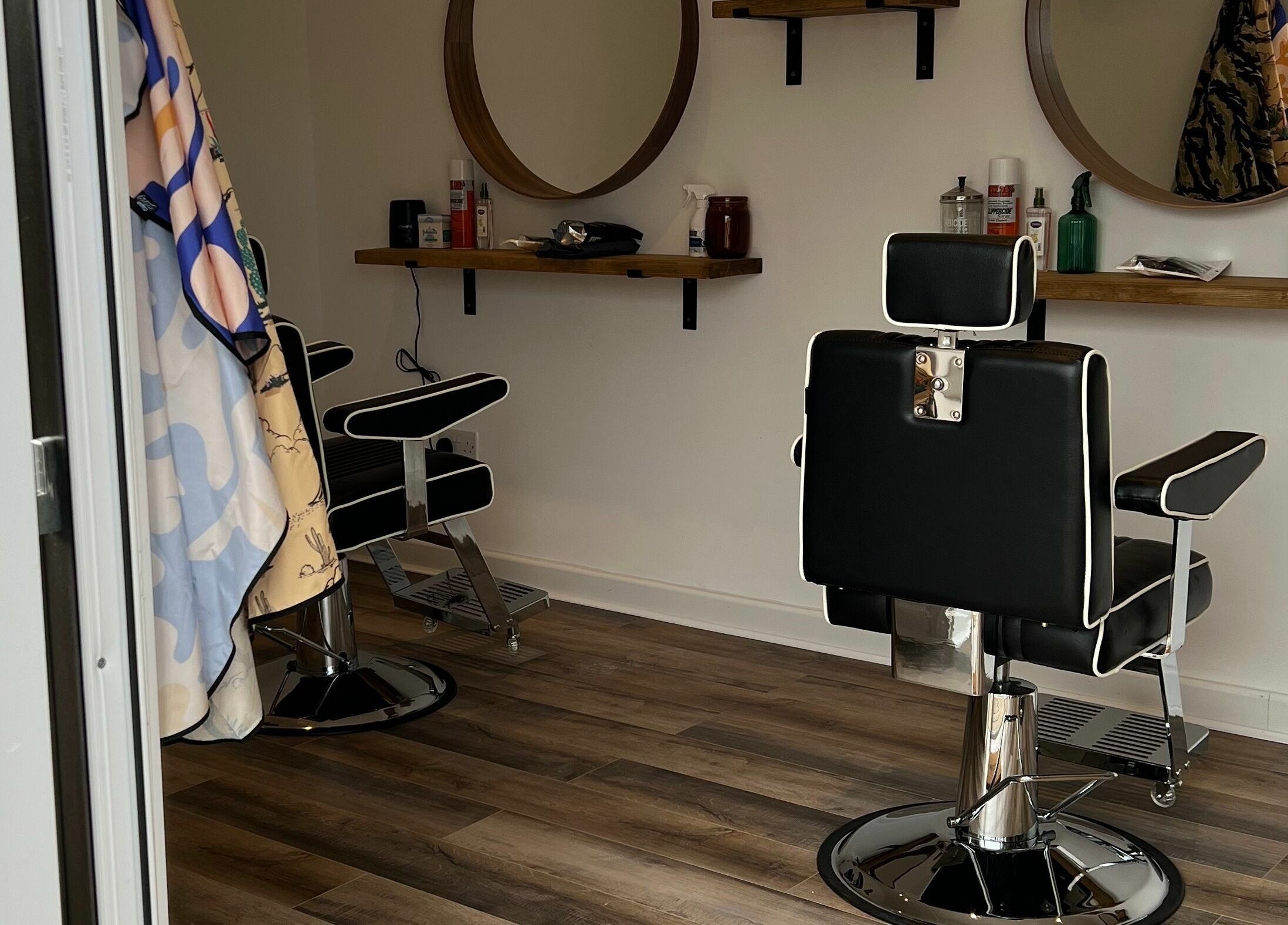 Modern barber chairs and mirrors at Headspace Barbers, Walsall, England, GB, showcasing stylish interior.