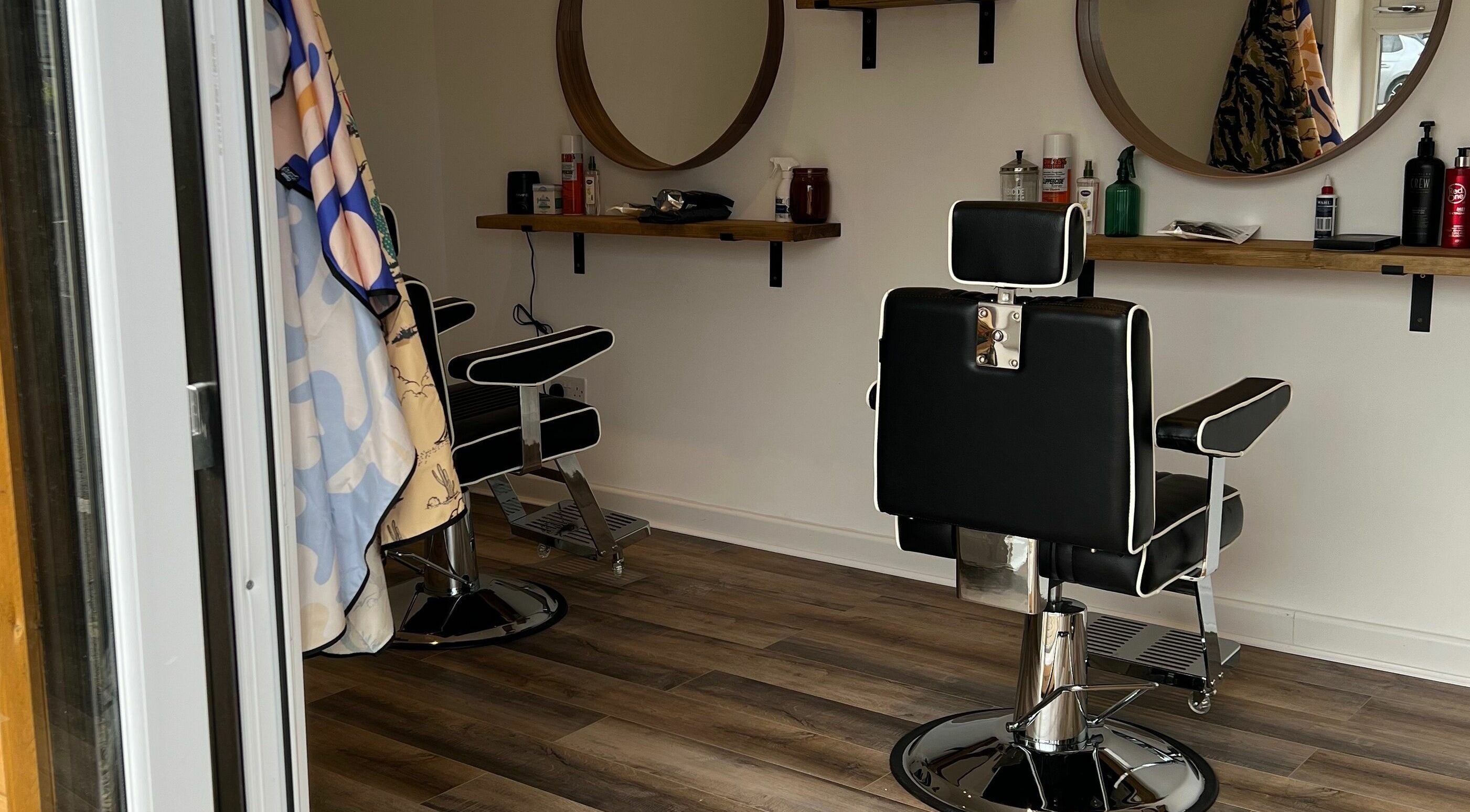 Modern barber chairs and mirrors at Headspace Barbers, Walsall, England, GB, showcasing stylish interior.