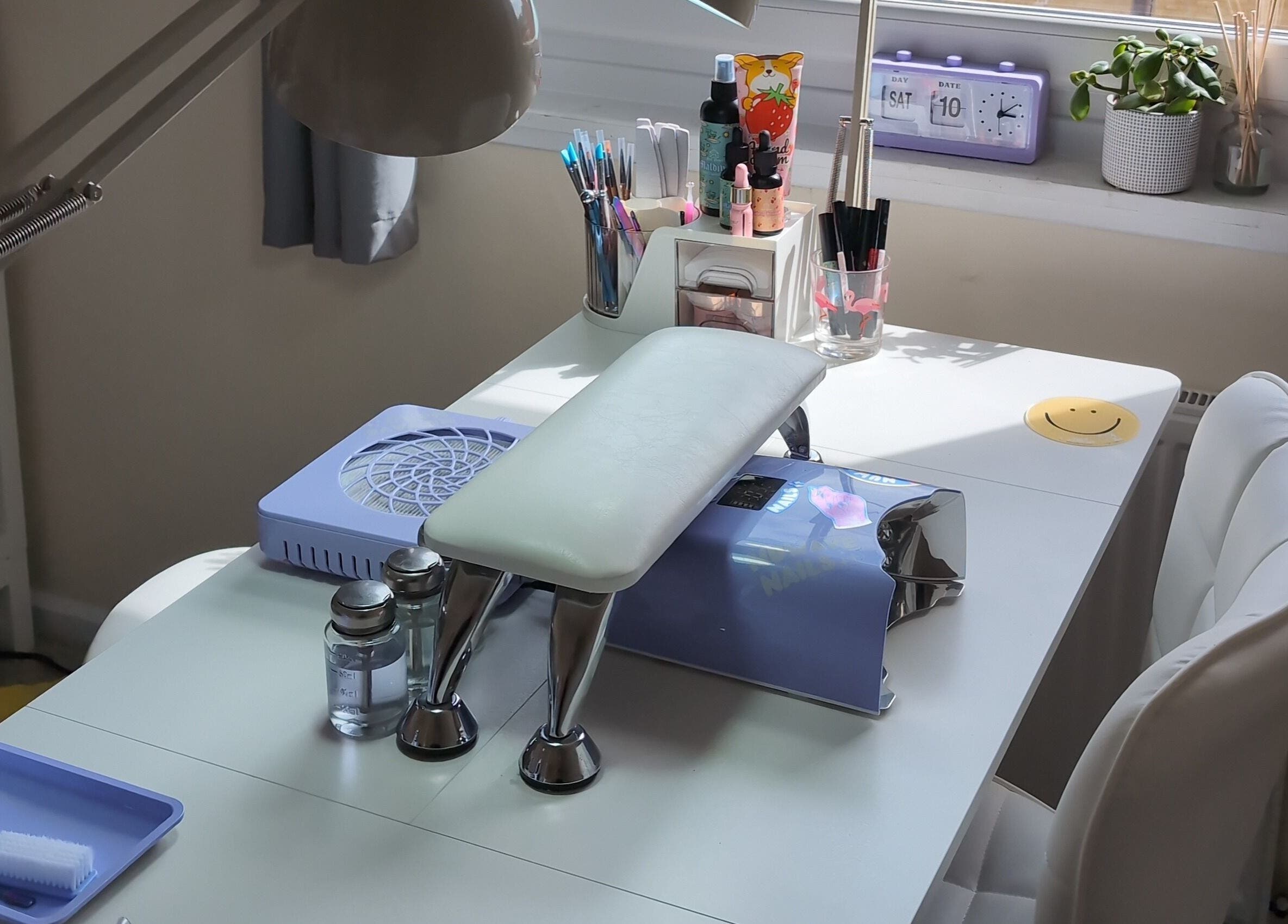 Modern nail station at NUWAVE NAILS - Prestwick (Home Studio) in Prestwick, Scotland, GB, with tools and decor.