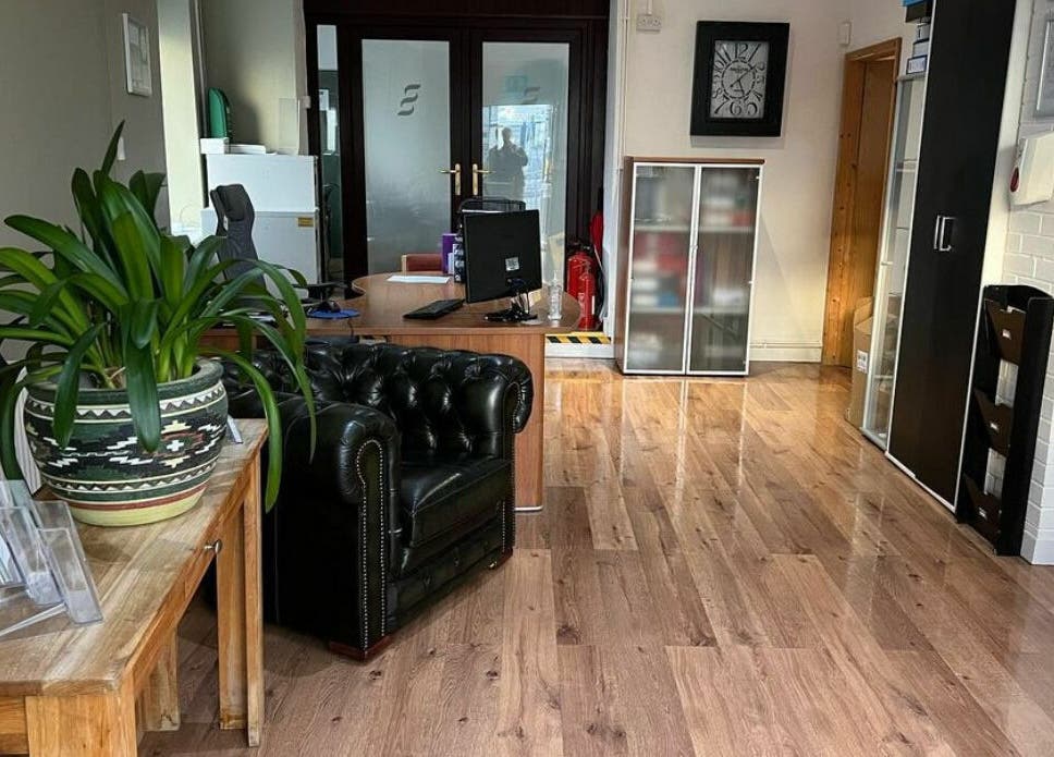 Reception area at Swansea Health Solutions in Gowerton, Wales, GB. Features sleek decor and comfortable seating.