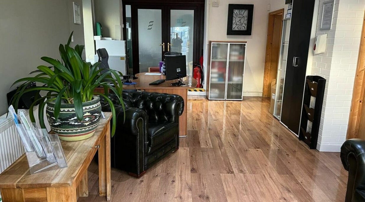 Reception area at Swansea Health Solutions in Gowerton, Wales, GB. Features sleek decor and comfortable seating.