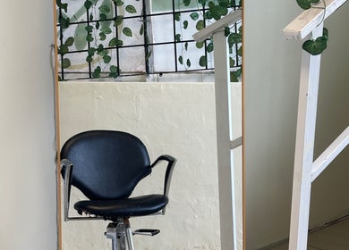 Styling chair with leafy decor at 12 Teaspoons, Randburg, Gauteng, ZA beauty venue.