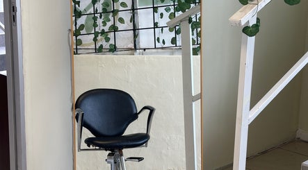 Styling chair with leafy decor at 12 Teaspoons, Randburg, Gauteng, ZA beauty venue.