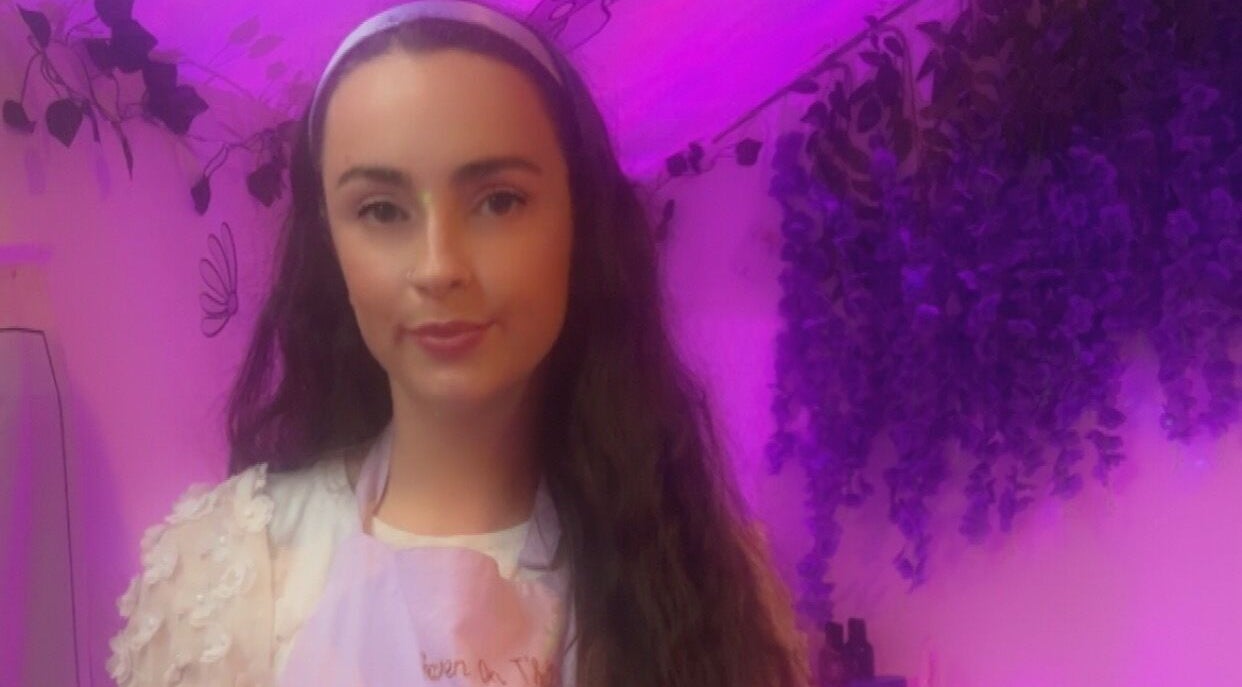 Woman in serene setting at Heaven On T'hill, Todmorden, England, GB. Lavender tones create a calm, inviting atmosphere.