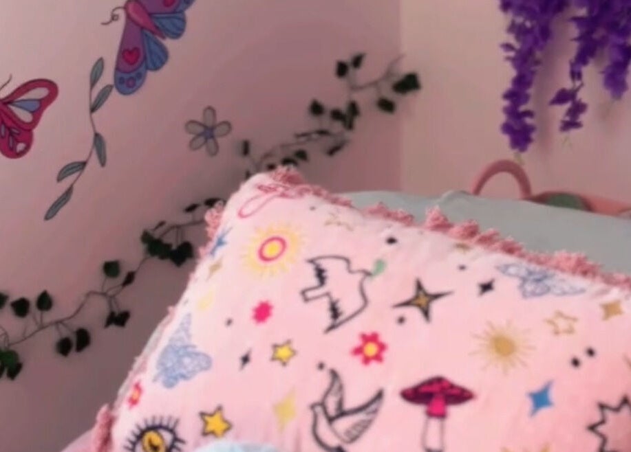 Whimsical butterfly-themed pillow in cozy space at Heaven On T'hill, Todmorden, England, GB.