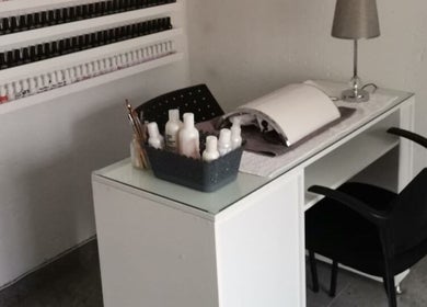 Modern nail station at Nails by Thuba in Benoni, Gauteng, ZA, showcasing stylish design and manicure essentials.