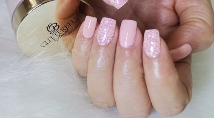 Glittery pink nails by Nails by Thuba in Benoni, Gauteng, ZA, showcasing delicate, glossy design.