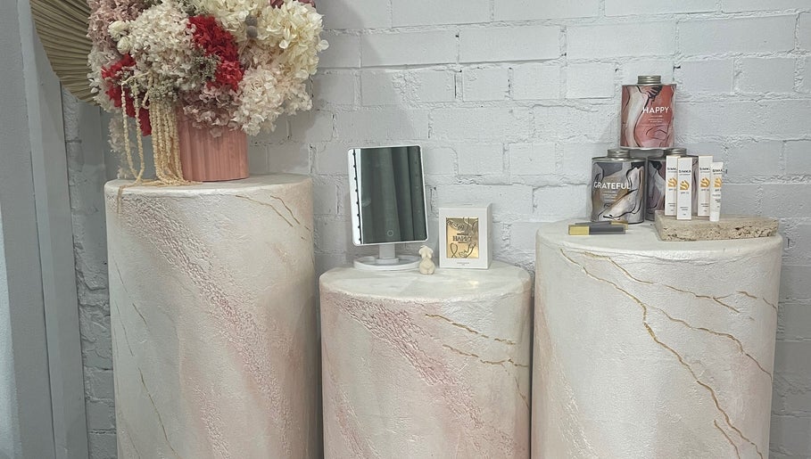 Elegant display of skincare products and flowers at VitalSkin Aesthetics, Annandale, New South Wales, AU.