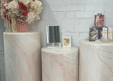 Elegant display of skincare products and flowers at VitalSkin Aesthetics, Annandale, New South Wales, AU.