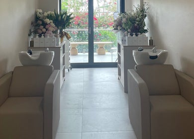 Elegant wash stations at Vital Skin Aesthetics, Birchgrove, New South Wales, AU, featuring fresh floral decor.